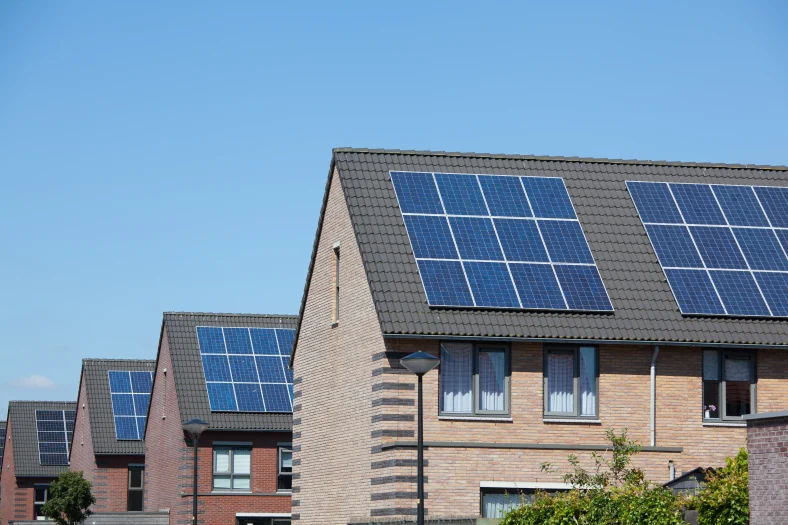 Modern houses with solar panels on the roofs