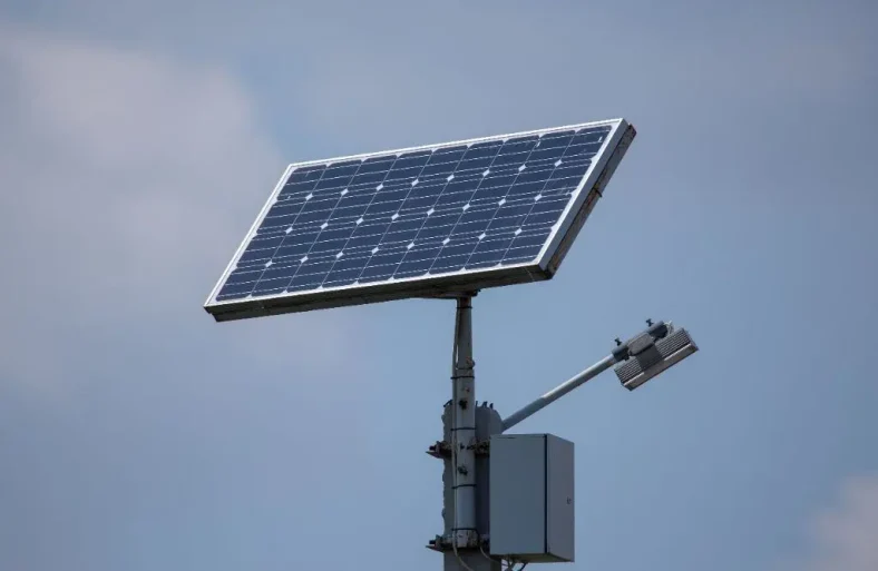 Autonomous LED street light projector with a solar panel.