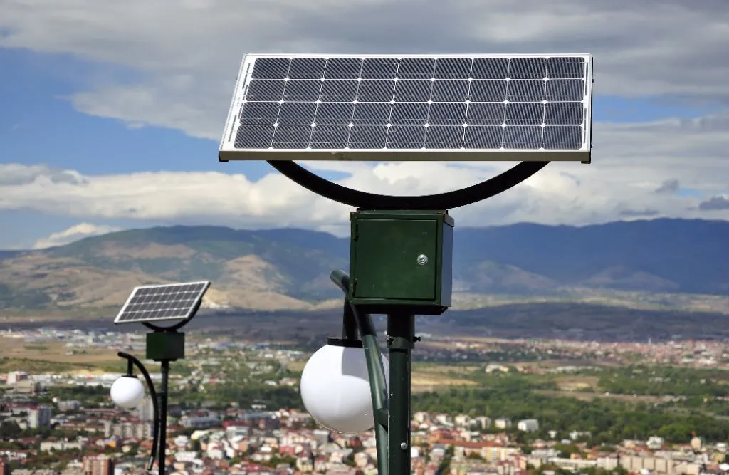 Pole-mounted solar panel street lights in the city.