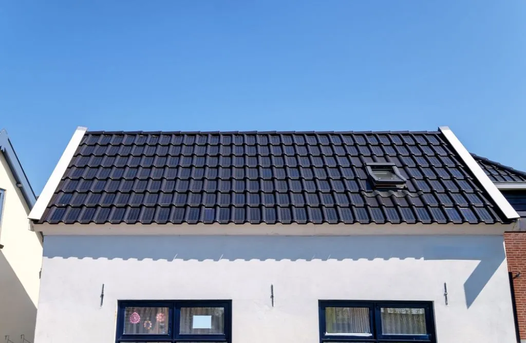 Classic photovoltaic roof shingles on the house