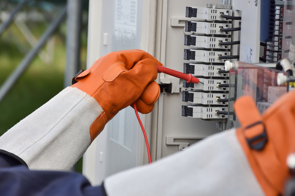 Service professional checks a solar panel