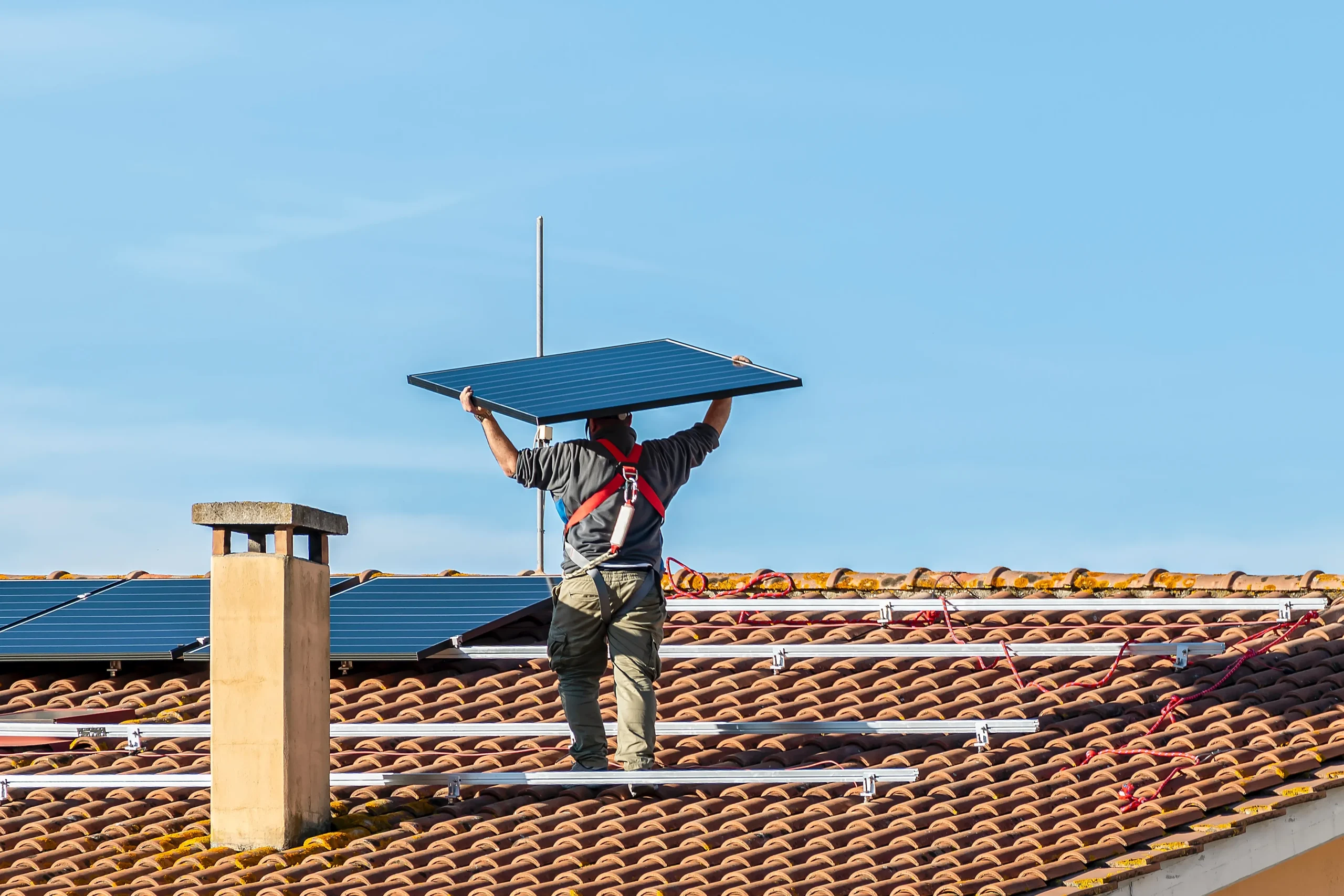 Solar installer carries the solar PV panel