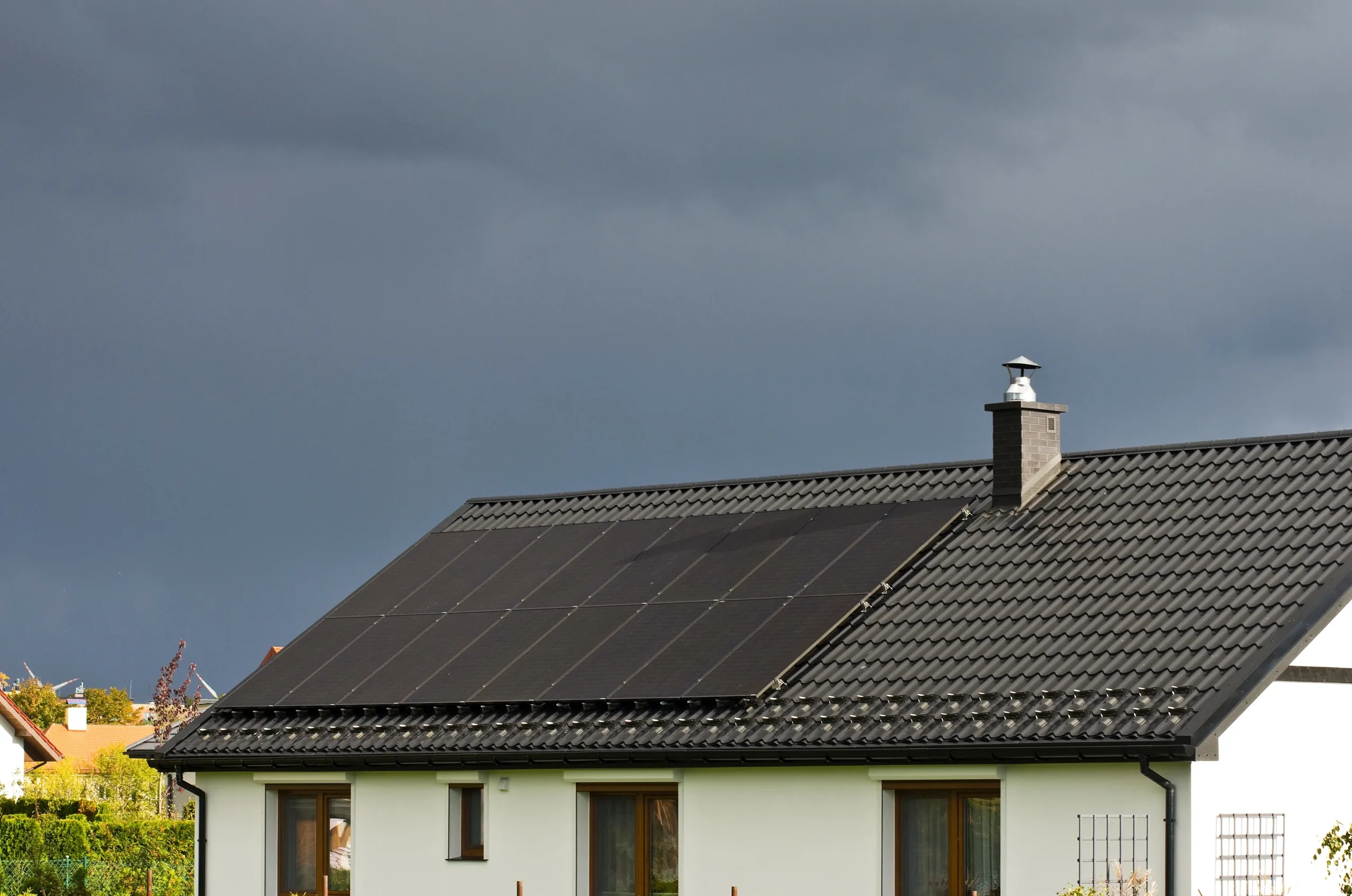 Solar panels on the roof of the building on a cloudy day