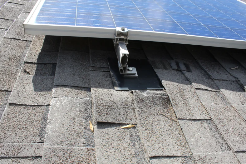 Damaged solar panel on the roof of the building