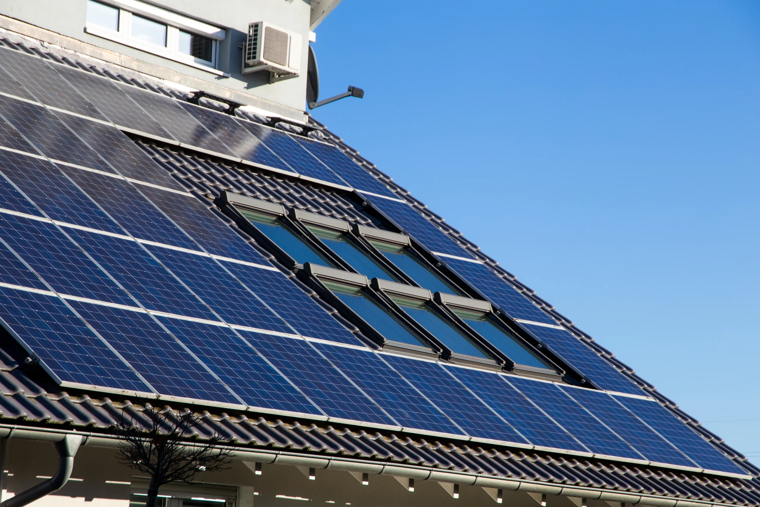 A house with the photovoltaic system installed on the roof