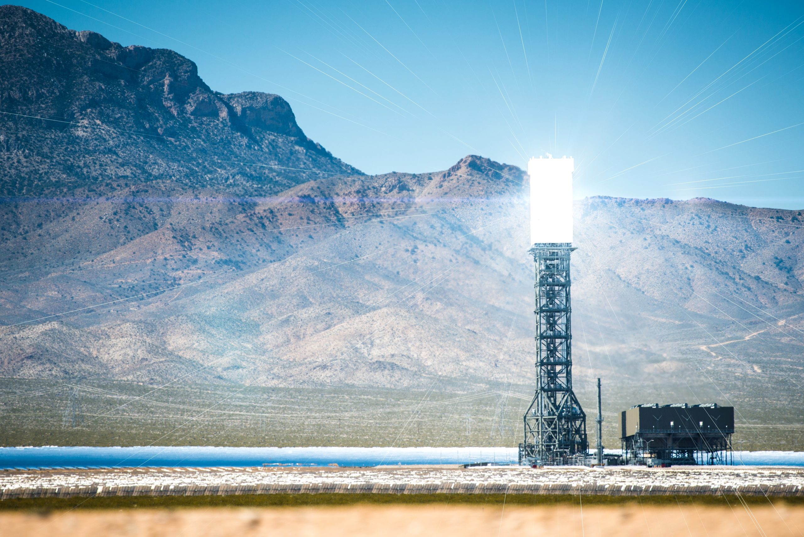 A thermal solar power plant located close to the mountains, which collects and concentrates sunlight to generate electricity