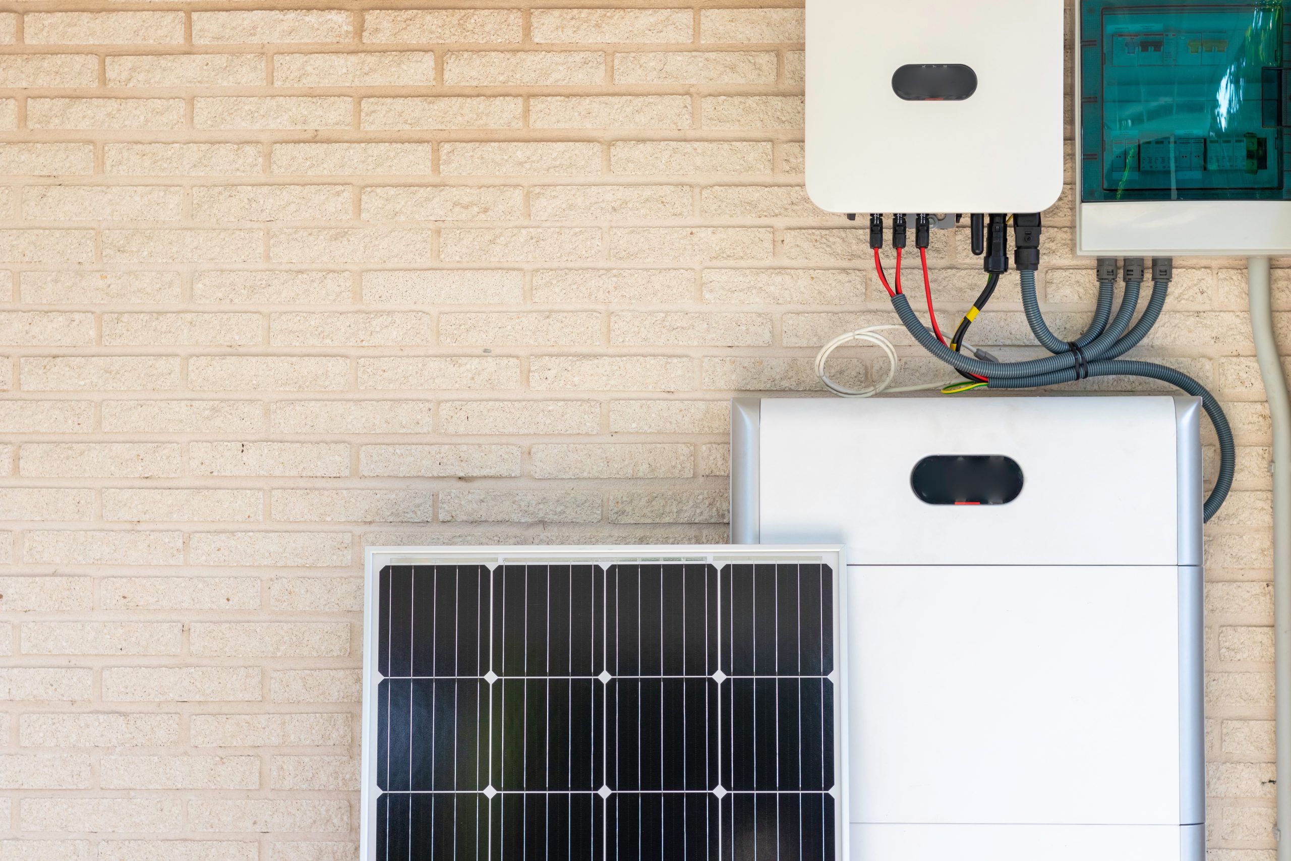 Front view of the solar battery installation leaning on the beige wall