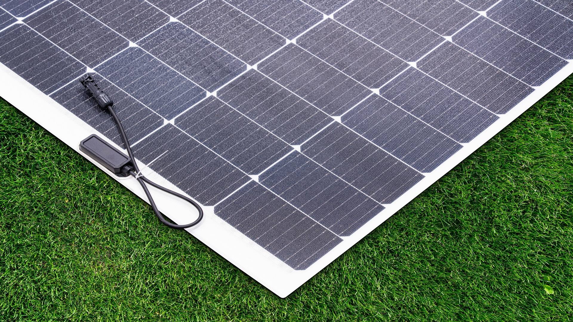 Close-up of a flexible solar panel placed on grass
